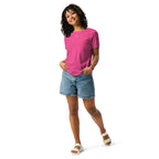 Woman wearing a pink Angel relaxed t-shirt and denim shorts on a white background