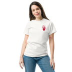Woman wearing a white t-shirt with a red blooming heart design on a white background
