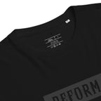 Black t-shirt with 'REFORM' branding on a white background
